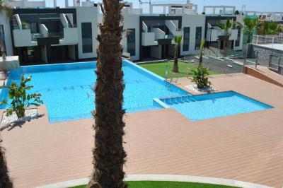 Apartamento en planta baja en Oasis Beach Punta Prima 8 Nº 035 in España Casas
